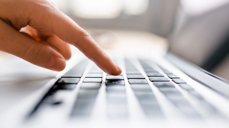 finger-press-button-laptop-keyboard